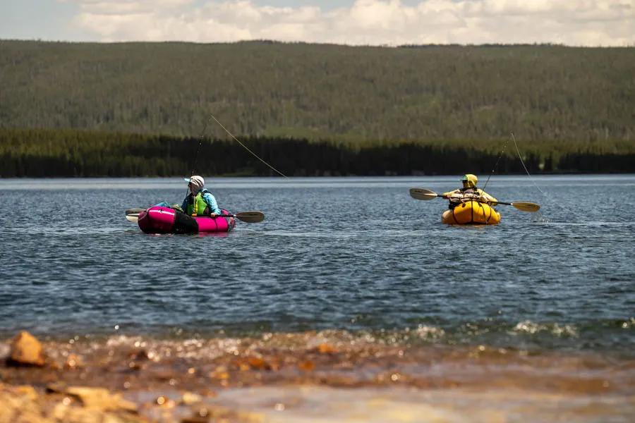 Fishing from a packraft. Anglers fish from packrafts during a backcountry fishing trip in Yellowstone National Park.