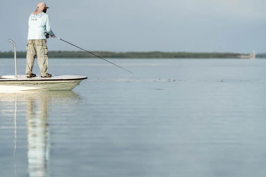 Sight casting is the norm when fishing the flats. Jay makes a cast to a group of tailing fish on a calm morning.